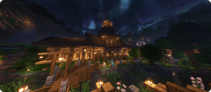 A Minecraft village build lit up at night